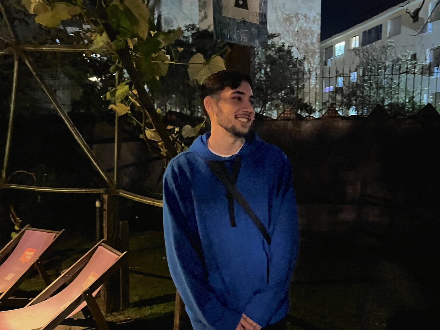 Yunguer in a blue hoodie at night